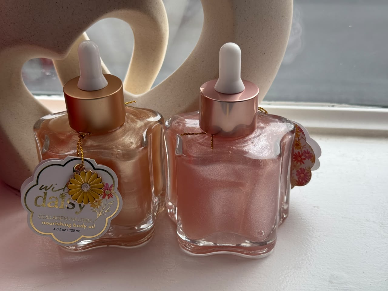 Wild Daisy Collagen-Infused Body Oil Beauty product photo at Sylvia Glow House, A nourishing oil with a luminous finish., for Nourishing moisture, Body oil texture, gallery view 2